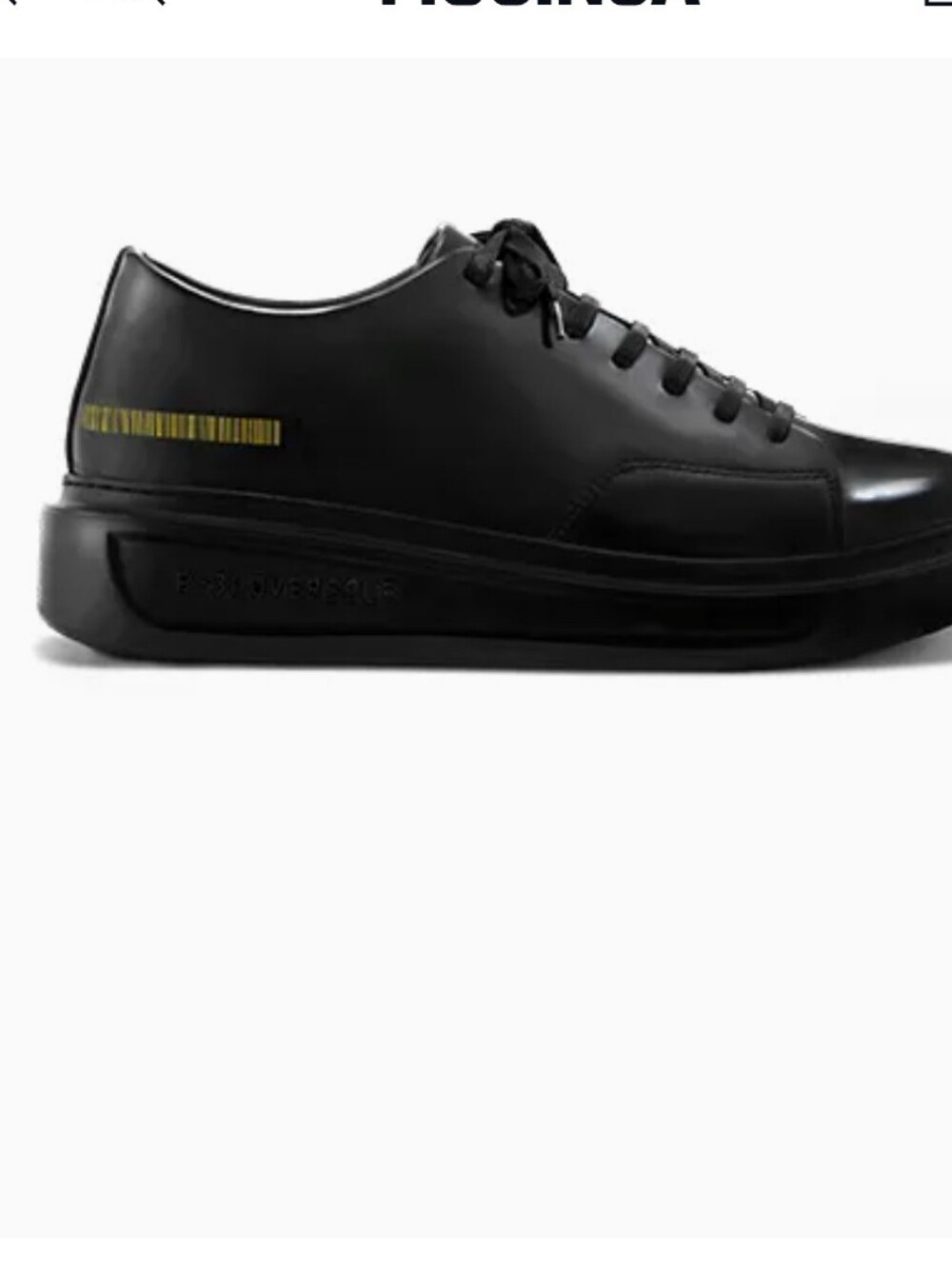 Black Low-Top Leather Sneakers with Subtle Gold Accent